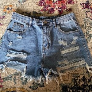 Distressed denim shorts